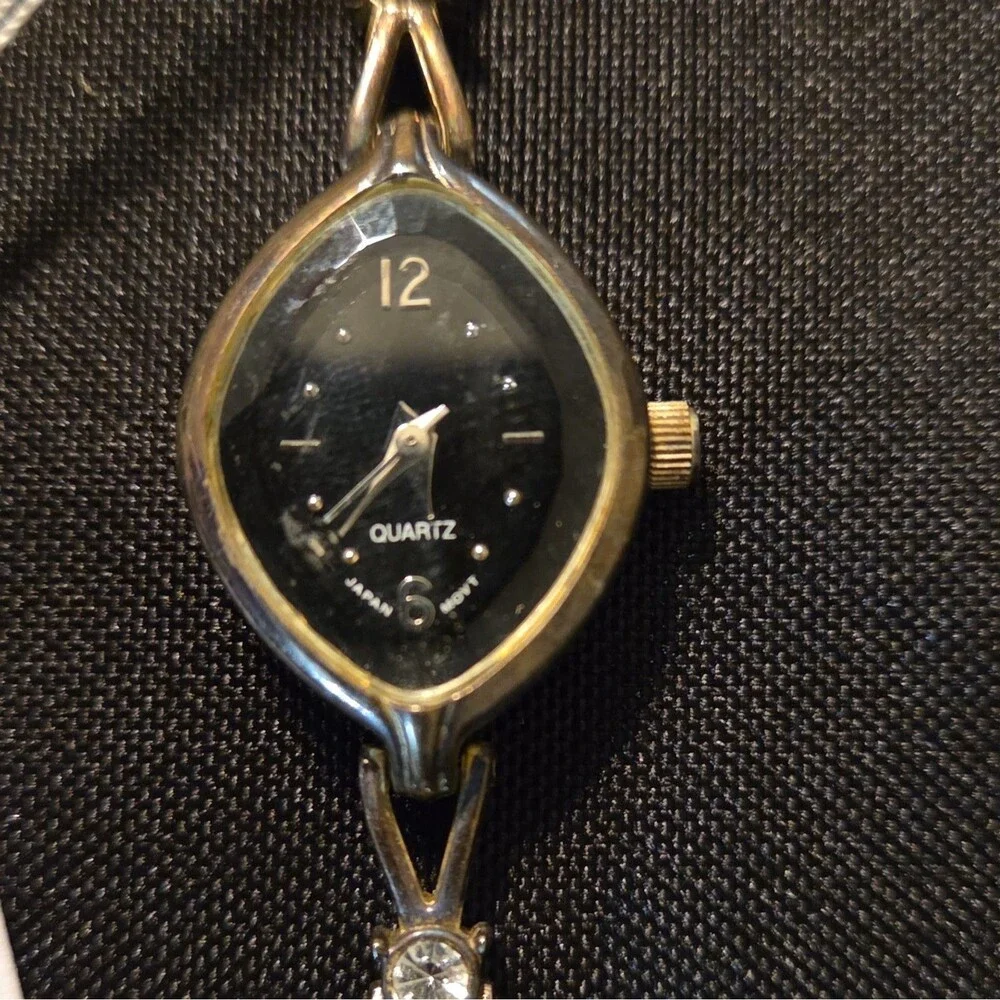 Vintage Avon Womens Quartz Watch Gold Tone Marquise Case Crystal Accents Black